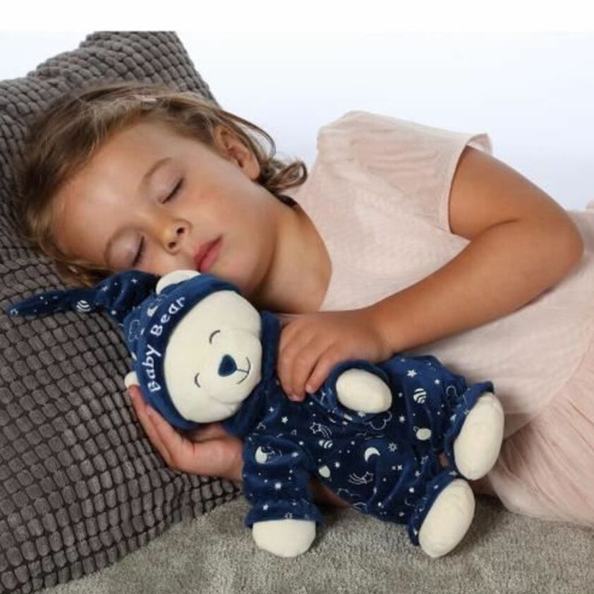 Peluche phosphorescente avec une petite fille qui dort 