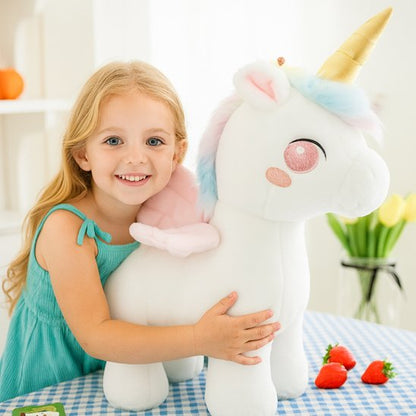 Licorne peluche blanche avec une crinière arc en ciel